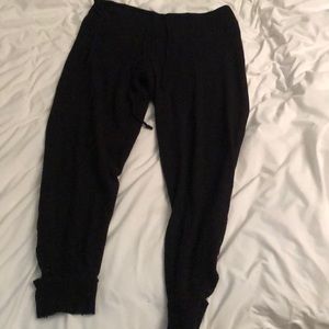 Black joggers with cut outs at bottom